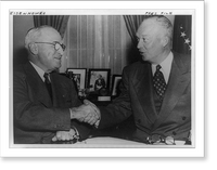 President Truman, left, shaking hands with Dwight D. Eisenhower while seated at table in the White House.United Press Photo. Classic, Historic Reproduction
