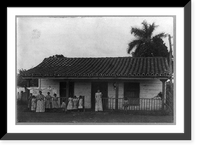 Two women and nine children posed standing in front of house and laundry line, Cuba, Vintage Poster