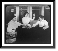 Seance with three women holding hands on table and one of them holding up bell, Historic Print
