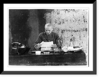 Historic Framed Print, [Generalissimo Chiang Kai-shek, half-length portrait, seated at desk, facing front, looking at paper, in his field headquarters],  17-7/8" x 21-7/8"