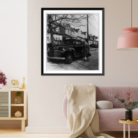 Historic Framed Print, [A Nurse from New York's Henry Street Visiting Nurse Center leaving her car to make a call on a patient who lives in one of the small one-family homes in a typical residential district of a New York suburb],  17-7/8" x 21-7/8"