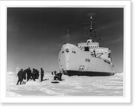 A group of the Coast Guardsmen building an igloo on the ie a short distance from the bow of the icebreaker Eastwind, Antique Print
