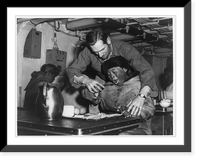 Frederick C. Langille, USCG, of Everett, Mass., helping an Eskimo to eat with a fork aboard the icebreaker Eastwind on a Coast Guard hydrographic mission on Baffin Island Timeless Wall Art Print