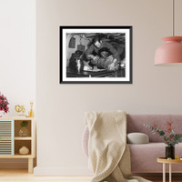 Frederick C. Langille, USCG, of Everett, Mass., helping an Eskimo to eat with a fork aboard the icebreaker Eastwind on a Coast Guard hydrographic mission on Baffin Island Timeless Wall Art Print