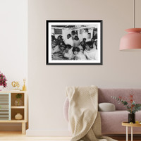 Eskimos watching movie aboard icebreaker Eastwind on Coast Guard hydrographic mission on Baffin Island, Vintage Print