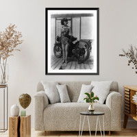 Historic Framed Print, [Young woman of Mack Sennett comedy films wearing bathing suit and policeman's hat standing by motorcycle],  17-7/8" x 21-7/8"