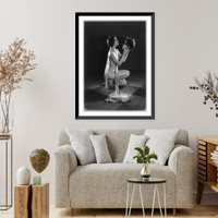 Historic Framed Print, [Mack Sennett comedy films. nude young woman kneeling and holding model of head of man],  17-7/8" x 21-7/8"
