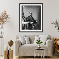 Hiram Rhoades Revels, Afro-American senator, three-quarter length portrait, seated by small table, facing right, Historic Reproduction