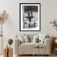 Historic Framed Print, [Two prisoners in pillory with another tied to whipping post below and man with whip in prison in Delaware],  17-7/8" x 21-7/8"