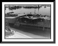 Damage inflicted upon the French battleship, Jean Bart, by American gunfire and bombs, Casablanca, French Morocco. A French sailor is standing guard over what is left of the bow Vintage Wall Art Pr