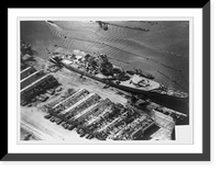 View of damage to the unfinished French battleship, Jean Bart, and sheds and pier damaged as the result of bombing and shell fire from U.S. fleet, Casablanca, French Morocco Vintage Wall Art Prin