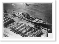 View of damage to the unfinished French battleship, Jean Bart, and sheds and pier damaged as the result of bombing and shell fire from U.S. fleet, Casablanca, French Morocco Vintage Wall Art Prin
