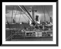 From the deck of a Coast Guard manned-transport that has just unloaded U.S. Army contingents, a combat photographer shot this picture of the bomb pocked waters off Sicily during the invasions Antiq