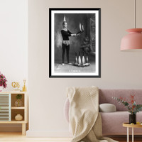 J.T. Doyle holding 2 burning juggling clubs, Vintage Print