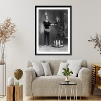 J.T. Doyle holding 2 burning juggling clubs, Vintage Print