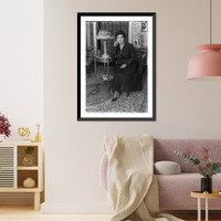 Amy Castles, full length portrait, seated, facing mostly left. Australian singer, Historic Reproduction