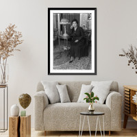 Amy Castles, full length portrait, seated, facing mostly left. Australian singer, Historic Reproduction