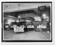 Historic Framed Print, [Parcel post area of mail room showing trucks and tables stacked with packages, U.S. Post Office, Washington, D.C.].National Photo Co., Washington, D.C.,  17-7/8" x 21-7/8"