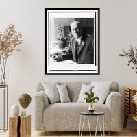 Dr. Charles Doolittle Walcott, Secretary of Smithsonian Institution, half-length portrait, seated at desk, facing front, Vintage Poster