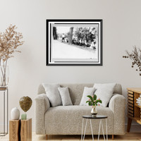 Group of boys with golf clubs. probably caddies. resting on hill Classic, Antique Poster