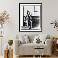 Historic Framed Print, [Arthur Simmons, White House staff member, seated in office lobby of the White House],  17-7/8" x 21-7/8"