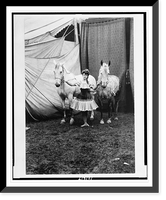Historic Framed Print, [Bareback rider standing between two horses outside circus tent],  17-7/8" x 21-7/8"