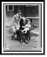 Charles Evans Hughes, seated, full-length, holding his grandson, with Charles Evans Hughes, Jr. seated on arm of the same chair - 2, Vintage Print