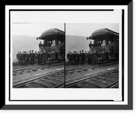 President Roosevelt, standing with twelve other men on railroad tracks, in front of locomotive, Antique Poster