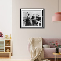 Historic Framed Print, [Donald Douglas, Glenn Martin and other employees of the Glenn Martin Co., Cleveland, Ohio, looking at model airplane],  17-7/8" x 21-7/8"