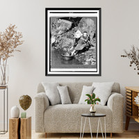 Historic Framed Print, A Peasant woman, with baby tied on her back, washing lettuce, on the shore of Lake Motosu, Japan,  17-7/8" x 21-7/8"