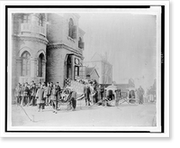 Asian men and Americans posed in front of building entranceway which is draped with an American flag, a girl sitting in a rickshaw and two sedan chairs, probably in China Heritage Wall Art Print