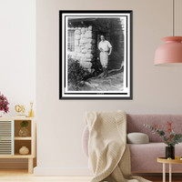 Historic Framed Print, [Robinson Jeffers, full-length portrait, facing slightly left, standing in front of stone building],  17-7/8" x 21-7/8"