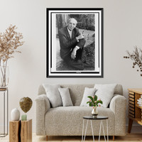 Aaron Copland, full-length portrait, seated, outdoors, facing front.Margery Smith, Vintage Poster