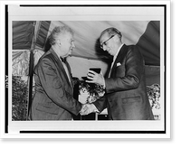 Edgard Varese shaking hands with Aaron Copland, with Mr. Copland receiving presentation, standing, half-length.Bernice B. Perry, Wilton, New Hampshire, Historic Print
