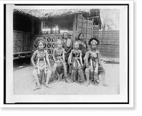 Historic Framed Print, [Six Javanese women, two in native dress, four in costume, full-length portrait, seated in front of Javanese dwelling, Paris Exposition, 1889],  17-7/8" x 21-7/8"