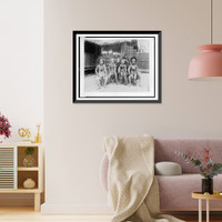 Historic Framed Print, [Six Javanese women, two in native dress, four in costume, full-length portrait, seated in front of Javanese dwelling, Paris Exposition, 1889],  17-7/8" x 21-7/8"