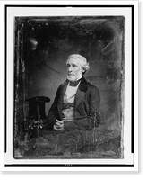 Historic Framed Print, [James Gordon Bennett, three-quarter length portrait, three-quarters to the left, seated, hands folded in lap, seated beside a small table with tablecloth on which rests a tall hat],  17-7/8" x 21-7/8"