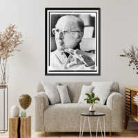 Bernard Malamud, head-and-shoulders portrait, facing left, left hand raised.photo by John Bragg, Historic Reproduction
