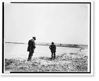 Black & White Photo - Chicago - Two men foraging along shoreline