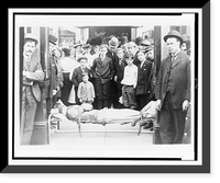 Harry Houdini strapped to cot, with crowd around him, Vintage Poster