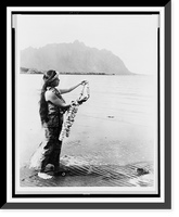 Native woman, standing at edge of water, holding lei, Antique Print