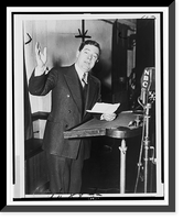 Historic Framed Print, [Huey P. Long, three-quarter length portrait, standing, facing slightly right, gesturing with right arm, as he speaks at microphone],  17-7/8" x 21-7/8"