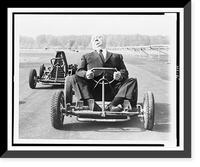 Alfred Hitchcock posed on a go-cart on a track outside Milan, Italy, Historic Print