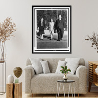 Alfred Hitchcock strolling about the grounds of his Bel Air estate, with his wife, Alma Reville, and his daughter, Patricia Classic, Antique Poster