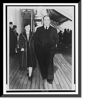 Alfred Hitchcock and his wife, Alma Reville, full-length portraits, walking on deck of the SS Queen Mary.Cosmo-Sileo Co. Classic, Vintage Print
