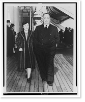 Alfred Hitchcock and his wife, Alma Reville, full-length portraits, walking on deck of the SS Queen Mary.Cosmo-Sileo Co. Classic, Vintage Print