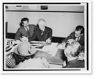 Historic Framed Print, [Frank Lloyd Wright, seated at a table with Roy S. Thurman; drawings for Crystal Heights in Washington, D.C., are on the table; reporters [?] take notes].Harris & Ewing.,  17-7/8" x 21-7/8"
