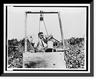 Eugene Talmadge, Georgia's governor-elect, drawing a bucket of water from a well on his farm at McRae, Georgia, Antique Print