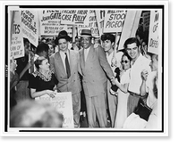 Robert Thompson and Benjamin Davis surrounded by pickets as they leave the Federal Courthouse in New York City.World Telegram & Sun photo by C.M. Stieglitz, Antique Poster