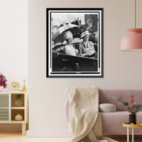 Mrs. Eleanor Roosevelt and Queen Elizabeth, holding umbrella, in automobile, leaving station for the White House, Historic Reproduction